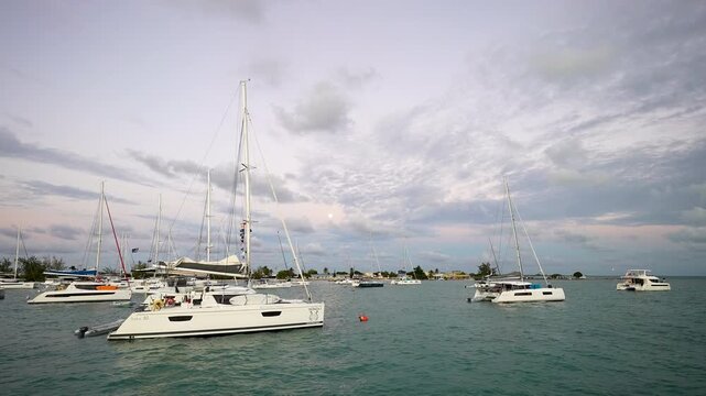 sailboats and catamarans are moored and anchored in Anegada cove