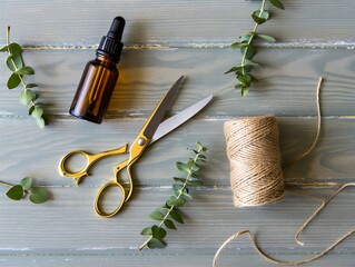 Crafting essentials on rustic wooden table with eucalyptus