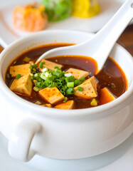 Hot Miso Soup Bowl with Green Onions and Tofu Cubes
