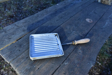 Vintage aluminum stovetop sandwich toaster or pie iron with a wooden handle for camping and home use