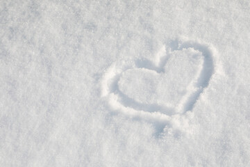 Heart drawn in the snow for Valentines day background.
