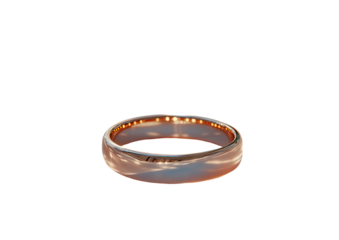 Gold ring reflects light on black backdrop