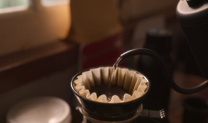 Pour hot water into coffee beans.