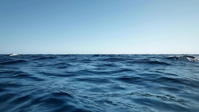 Ocean Waves Under Clear Blue Sky Abstract View Showing Horizon Line and Ripple Water Surface