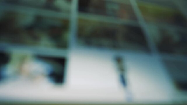 Blurred image of a computer screen displaying multiple thumbnails