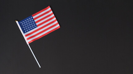 Minimalist American flag on dark background representing USA Independence Day, solemn remembrance,...
