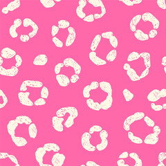 Leopard print. White cartoon spots on pink background.