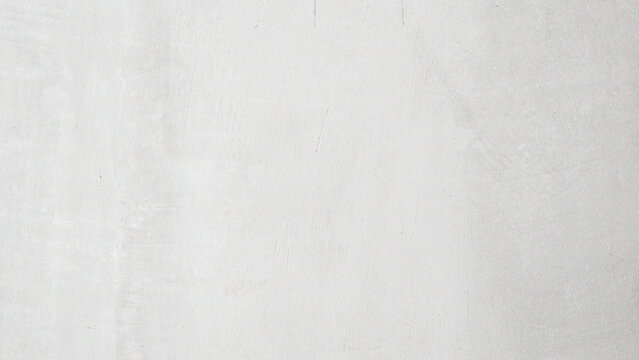 A white wall with a grey texture. The wall is empty and has no decoration. The wall is plain and simple