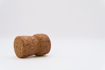 Bottle cork on a white background for wine or champagne, cork tree, alcohol and health risks, problems in the family due to alcohol, wine for relaxation. High quality