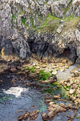 High angle view at a dramatic rocky coast at a sea bay
