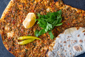 Big size  lahmacun on black stone background