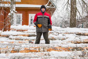 Russia. The life of ordinary people. A man, 50 years old, gathers firewood to heat his house and...