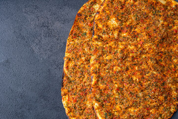 Big size  lahmacun on black stone background