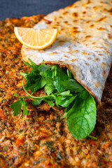 Big size  lahmacun on black stone background