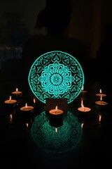 Glowing mandala surrounded by candles