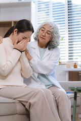 Fototapeta premium Stressed female patient are treated by a psychologist or psychiatrist in a psychiatric clinic or hospital.