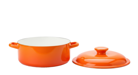 A bright orange, pristine, empty enamel cooking pot with a matching lid, on a seamless transparent studio background with copy space, clean cooking concept