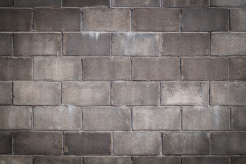 Old grey concrete blocks wall texture background.