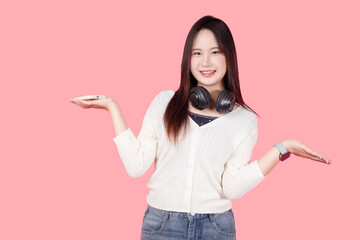 young teen girl happy smile enjoy music from phone, listening music by headphone studio isolated