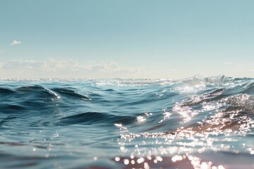 Sparkling blue ocean waves gently roll under a clear sky. Ideal for backgrounds, relaxation, travel, or water concepts.