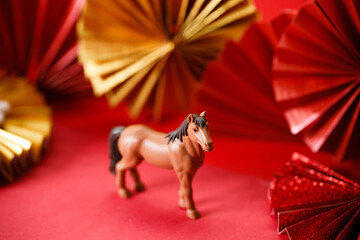 A festive Chinese New Year background with red paper fans.