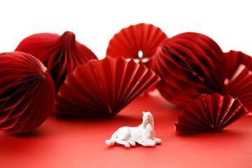 A festive Chinese New Year background with red paper fans.