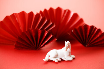 A festive Chinese New Year background with red paper fans.