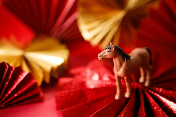 A festive Chinese New Year background with red paper fans.