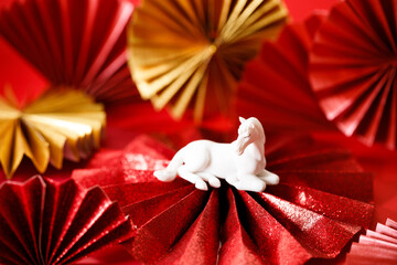 A festive Chinese New Year background with red paper fans.