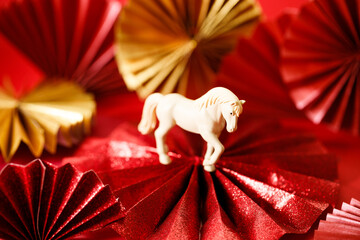A festive Chinese New Year background with red paper fans.