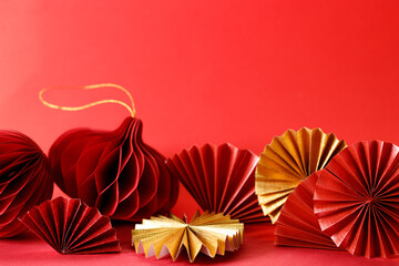 A festive Chinese New Year background with red paper fans.