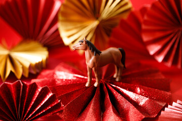 A festive Chinese New Year background with red paper fans.