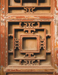 Close-Up of Weathered Wooden Door Featuring Traditional Patterns and Peeling Paint Texture, Cultural Heritage Aesthetic, Authentic Architectural Detail and Timeless Craftsmanship Visual