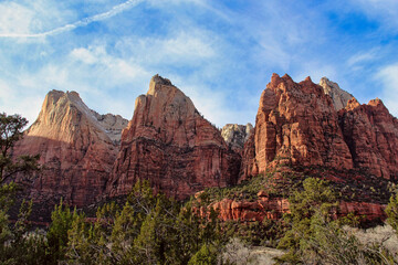 Fototapeta premium The Brilliant Red Mountains of the Court of the Patriarchs on a Late Afternoon in the Winter, Zion National Park in Utah.