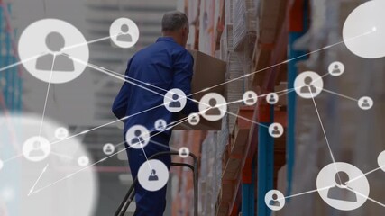 Animation of network of connections with icons over caucasian man in warehouse - Powered by Adobe
