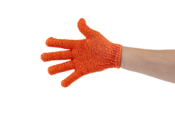 An orange exfoliating glove in a hand against a transparent background.
