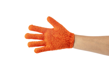 An orange exfoliating glove in a hand against a transparent background.