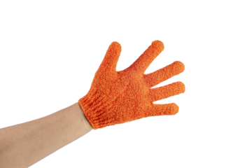 An orange exfoliating glove in a hand against a transparent background.