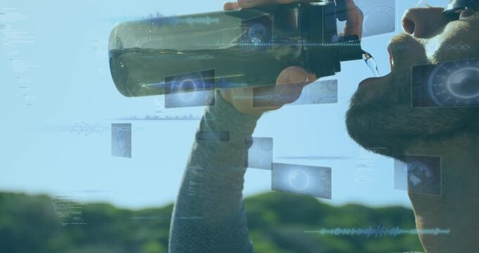 Animation of data processing on screens over fit caucasian man drinking water