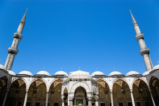Courtyard of Blue Mosque in Istanbul with ablutions fountain and two minarets