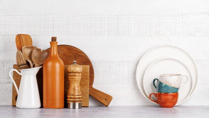 Kitchen utensils and cutting boards on table