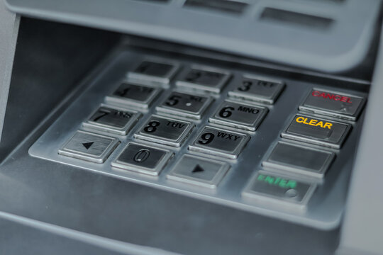 ATM Keypad Close-Up for Secure Banking Transactions with Natural Light and Copy Space emphasizing financial security and modern banking technology.