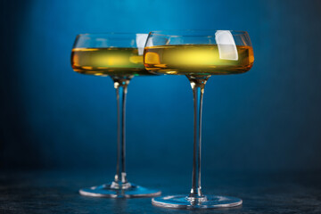 Champagne glasses on dark blue background