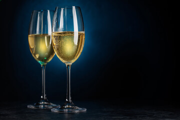 Champagne glasses on dark blue background