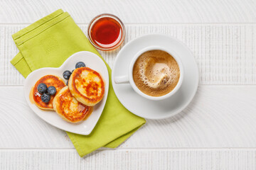 Homemade pancakes with blueberries and syrup