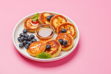 Homemade pancakes with blueberries and syrup