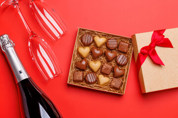 A glasses of champagne elegantly paired with a box of rich chocolates