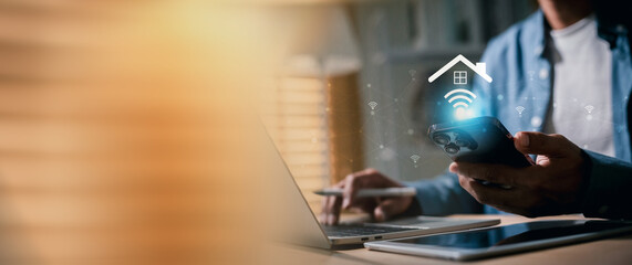 Man smartphone to manage a smart home system  Wi-Fi connection, represented by a glowing house icon with wireless signals . connectivity and remote control of home automation.