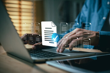 businessman use  laptop  review and manage digital documents, symbolized by floating icons.  checkmark signifies successful document approval, verification, or smart contract execution