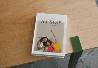 Mockup Of A4 Magazine With Customizable Front Cover On Table